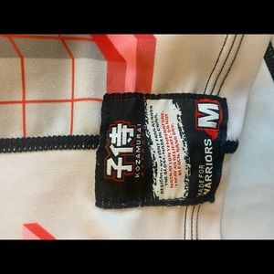 2 kids unisex jujitsu Kozamurai rash guards. Fits kids grades 2-4.  Sold as set.